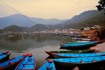 Boats Beached Outside Mountain Town