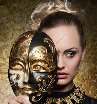 close-up of girl with baroque mask 