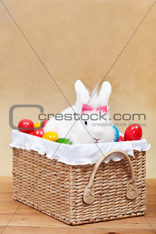 Cute easter bunny with colorful eggs