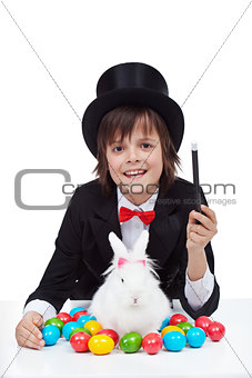 Young magician boy preparing for easter