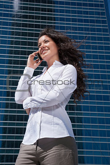 white shirt businesswoman talking mobile