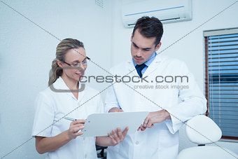 Dentists discussing reports