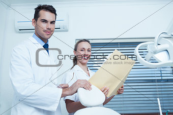 Portrait of dentists with reports