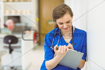 Young medical student taking notes