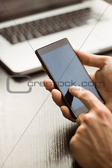 Student touching his mobile phone