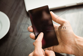 Student touching his mobile phone