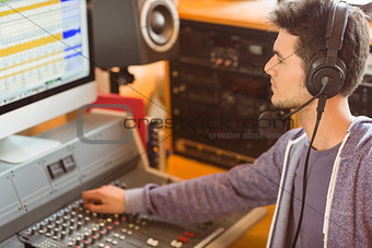 Portrait of an university student mixing audio