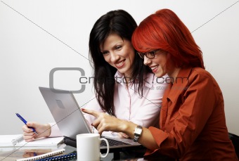 two beautiful women are working 