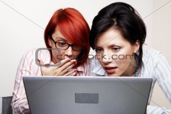 Two businesswomen are very surprised