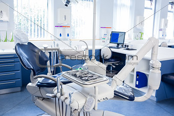 Inside of the clinic with dentists chairs, computer and tools