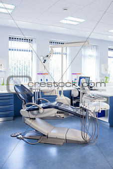 Inside of the clinic with dentists chairs, computer and tools