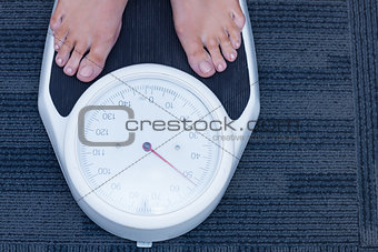 Close up of a woman standing on the scales