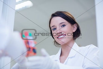 Young female biologist smiling at the camera