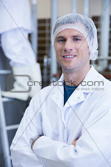Portrait of a smiling scientist with arms crossed