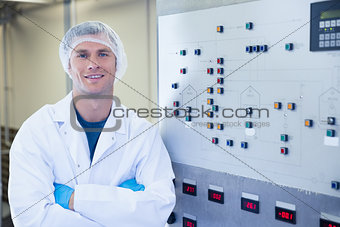 Portrait of a smiling scientist with arms crossed
