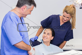 Dentist and nurse introducing a patient
