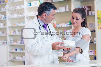 Pharmacist and patient speaking about blood pressure