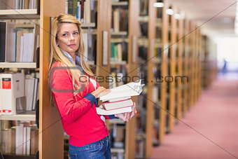 Mature student standing in library
