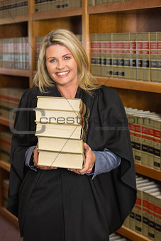 Lawyer holding books in the law library