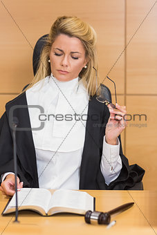 Stern judge reading her notes