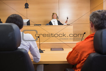 Lawyer and client listening to judge