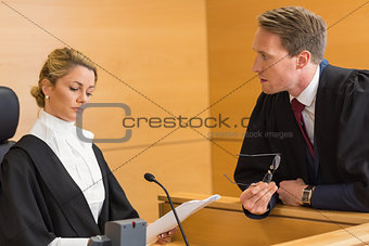 Lawyer speaking with the judge