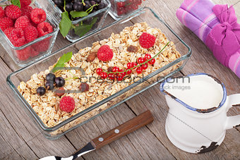 Healthy breakfast with muesli, milk and berries