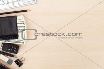 Office table with pc, supplies and money cash