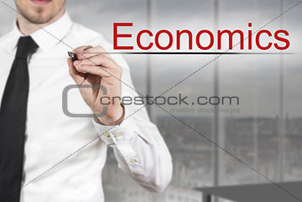 businessman writing economics