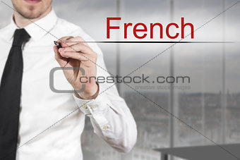 businessman writing french in the air