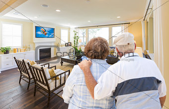 Senior Couple Overlooking A Beautiful Living Room