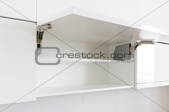 opened kitchen cabinet