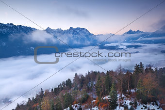 view on foggy sunrise from mountain top
