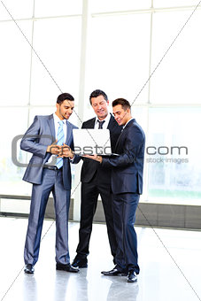 group of business people doing presetation with laptop