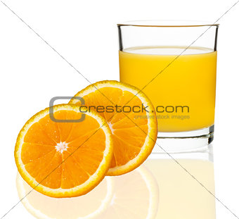 orange juice in a glass with oranges