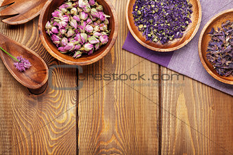 Spices and utensils over wooden table