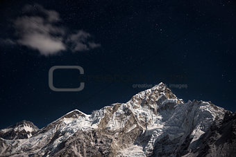 Mt. Everest and Lhotse beneath a star filled night sky
