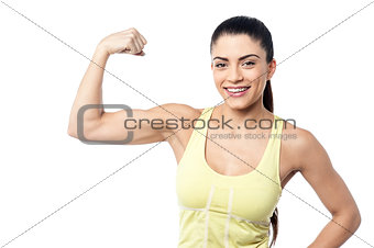 Strong sporty woman posing