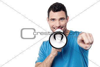Man with loudhailer and pointing forward