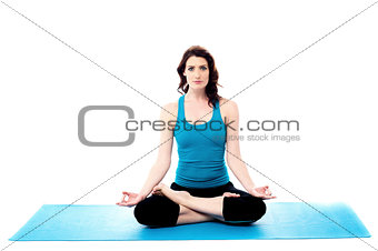 Young woman doing yoga, isolated on white