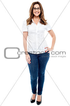 Smiling woman with hands on hips