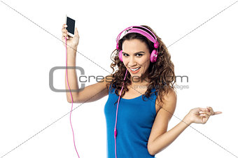 Preety woman listening to the music from smart phone