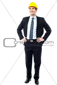 Engineer posing with hands on waist