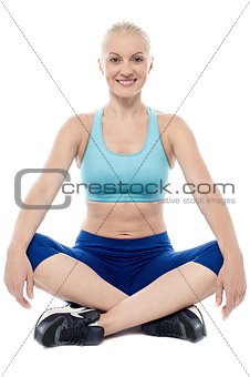 Athletic woman sitting and resting