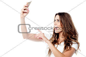 Pretty girl taking a picture of herself