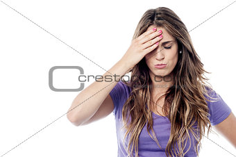 Tensed woman touching her head