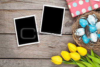 Easter background with blank photo frames, blue and white eggs, 