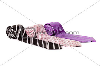 multicolored ties on a white background
