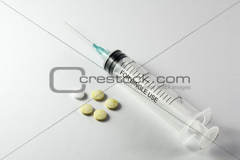 Syringe and tablets