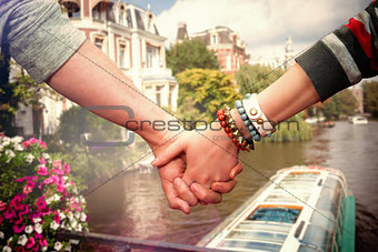 Composite image of students holding hands